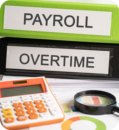 Payroll and overtime files with calculator, showing how constant schedule changes drive overtime costs.