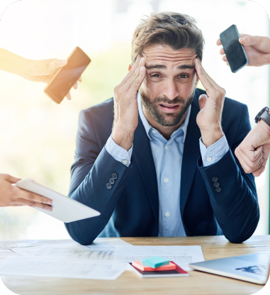Overwhelmed manager surrounded by papers, representing production backlogs and bottlenecks piling up.